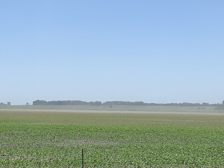 dust cloud in crop field