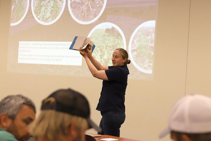 Elizabeth Gray holds soil color chart