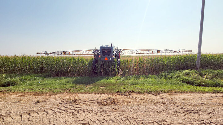 Highboy interseeder in field