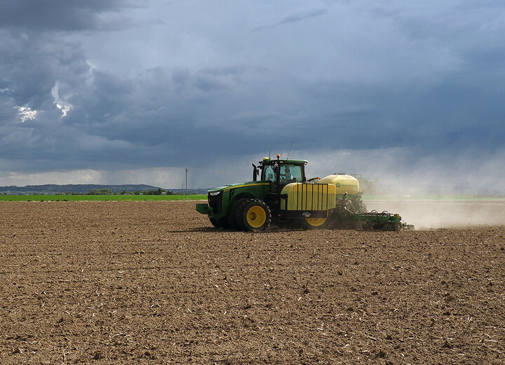 Tractor in field planting