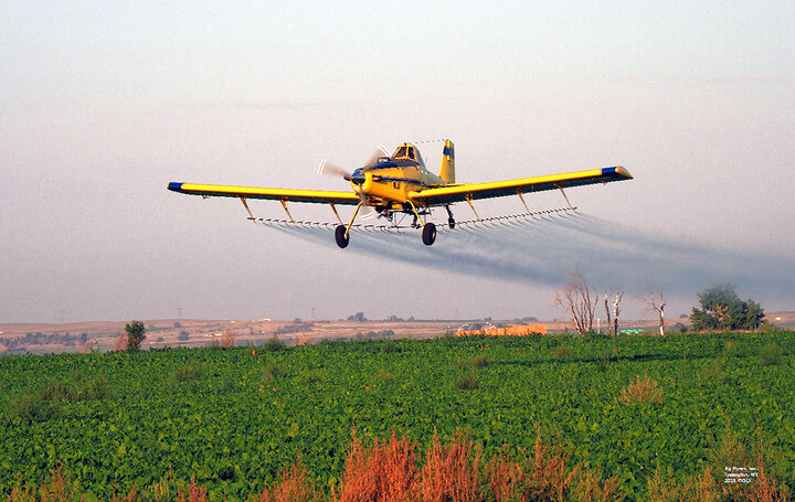 Tractor in field planting