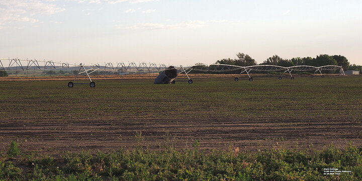 Damaged center pivot in field