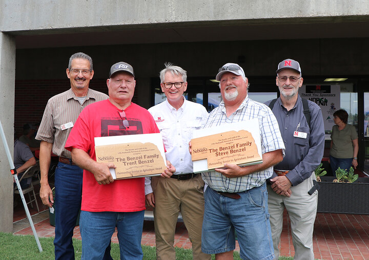 John Thomas, Trent Benzel, John Westra, Steve Benzel, and Gary Stone smile at camera