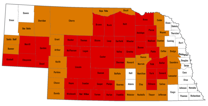 Map of Nebraska counties showing USDA drought disaster designations. Counties in red are primary counties eligible for assistance, and counties in orange are contiguous counties also eligible. White counties are not currently designated.