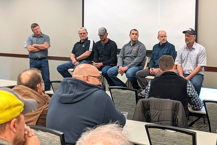 A group of six panelists sit at the front of a classroom answering questions from attendees during a nitrogen management discussion featuring Sentinel Ag users.
