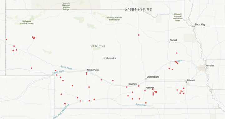 Map of Nebraska showing monitoring locations marked with red dots across the state, with higher concentrations in central and southern regions.
