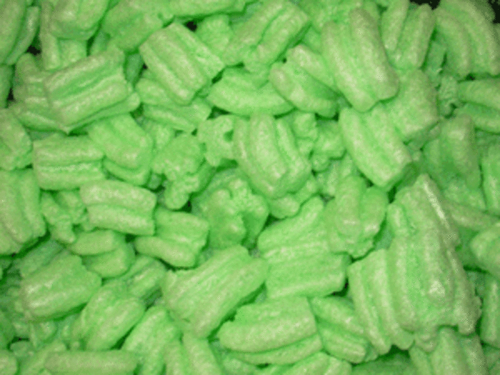 Photo of green packing peanuts described in the cutline.