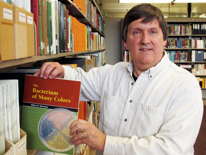 UNL Plant Pathologist Bob Harveson with his book