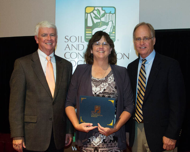 Claudia Stevenson with Jim Guilliford (left) and Jon Scholl.