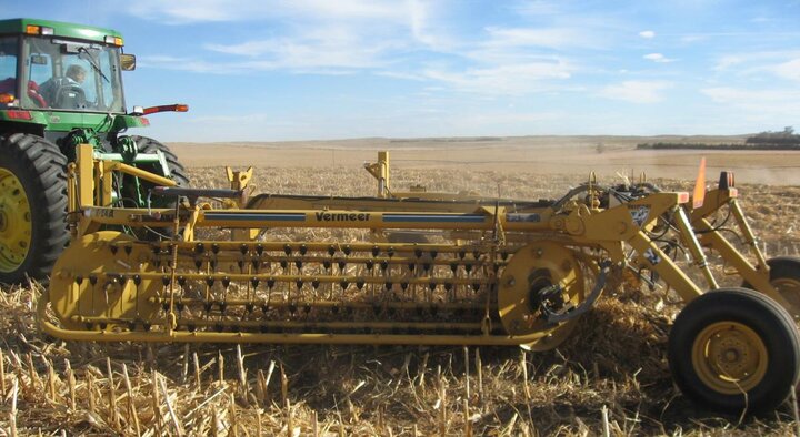 Raking up downed corn