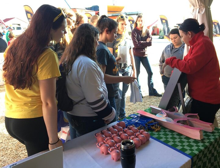 Nebraska Extension Educator talking with high school students at 2018 Husker Harvest Days