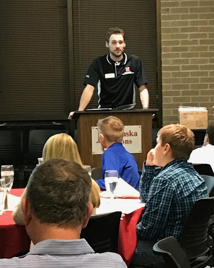 Justin McMechan addressing youth at the IYCC banquet.