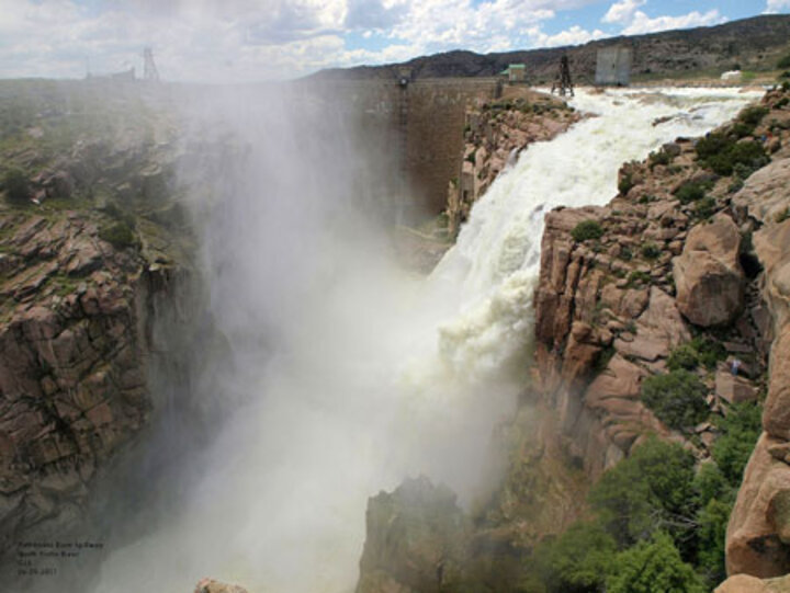 Pathfinder dam with natural spillway