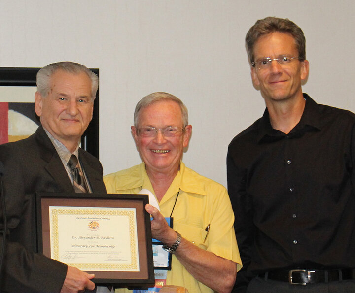 Alex Pavlista receiving award