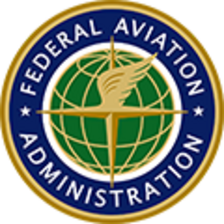 Seal of the Federal Aviation Administration, featuring a gold wing and compass over a green globe, encircled by a blue ring with white text.