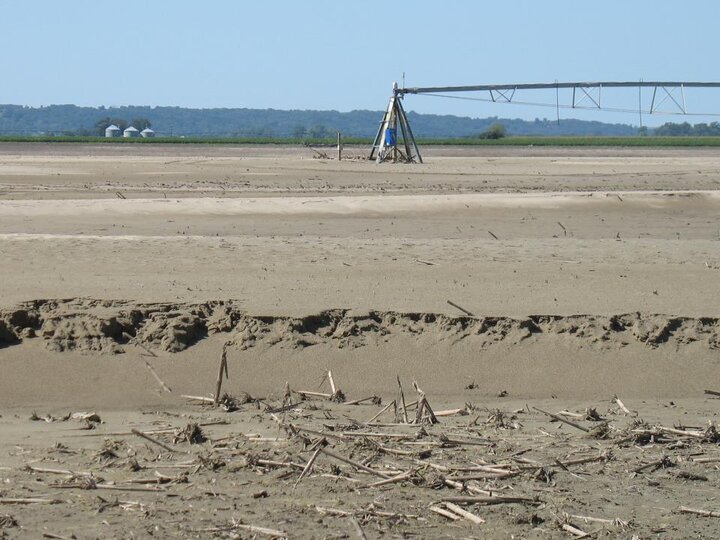 Sand-covered field with a center pivot