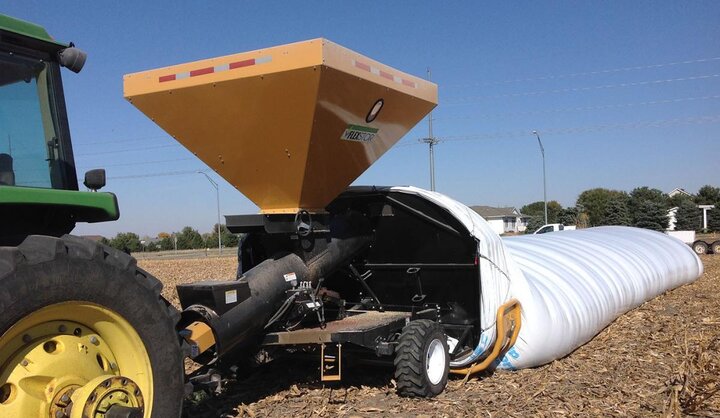 Grain bagger in field