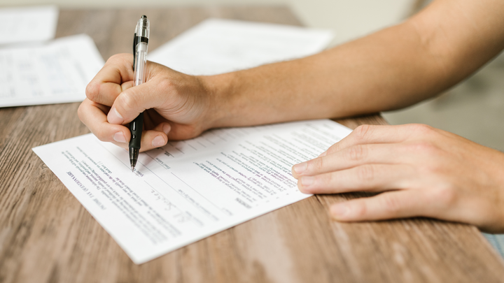 woman filling out paperwork