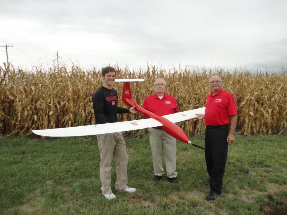 (From left) Matt Headrick, George Meyer and Wayne Woldt conduct a preflight check on an unmanned aircraft system. 