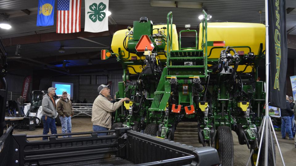 Grower examining a new sprayer at the Soybean Day and Machinery Expo