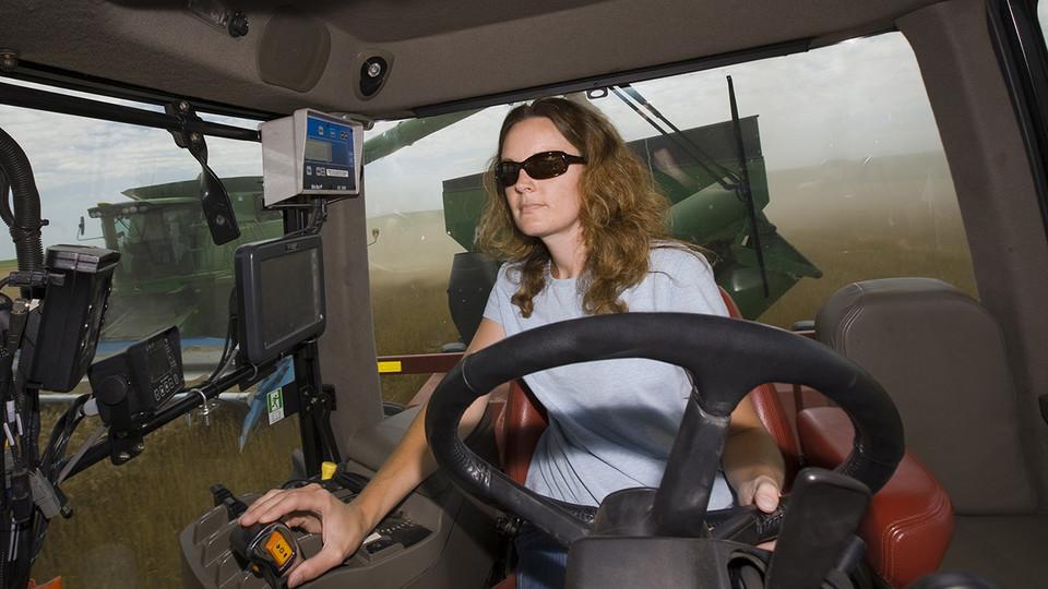 woman driving a tractor