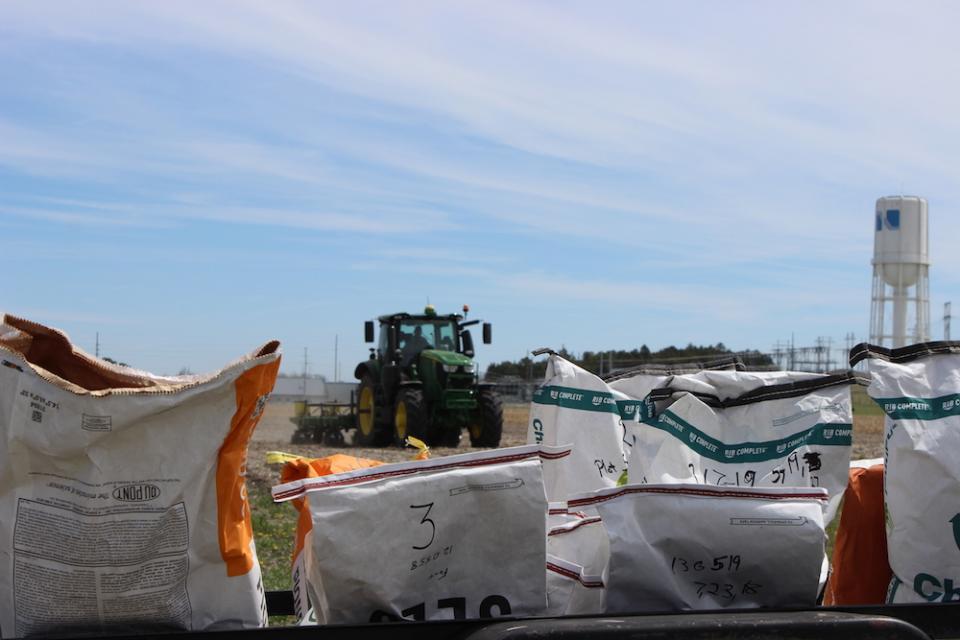 tractor behind bags of soil