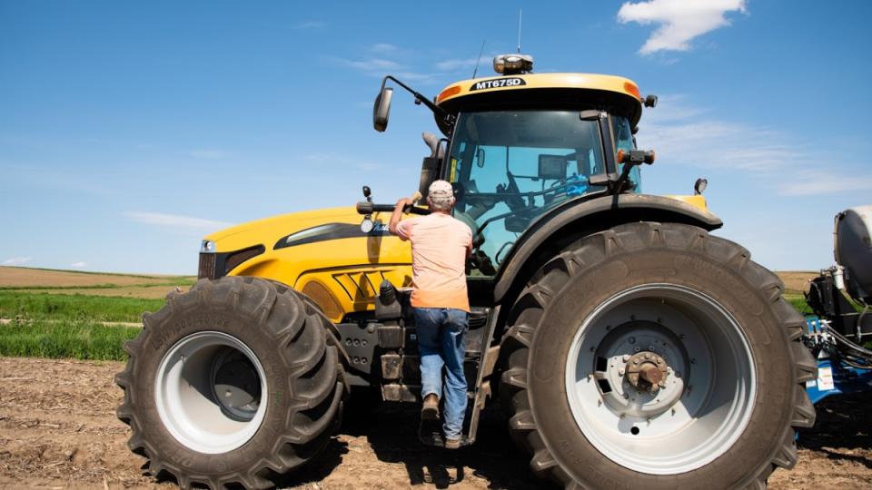 Farmer entering tractor