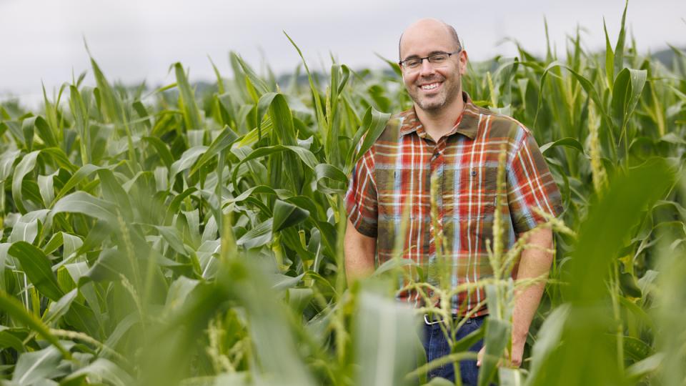 James Schnable standing in a corn field
