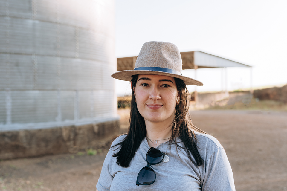 Woman farmer near grain bin