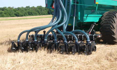Manure being injected in wheat residue