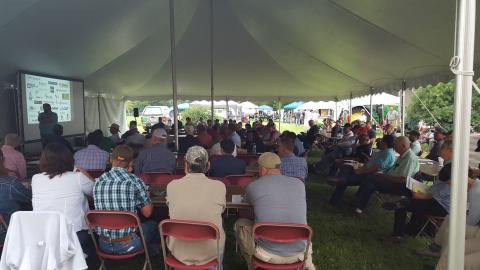 Attendees under a tent at a previous Water and Crops Field Day