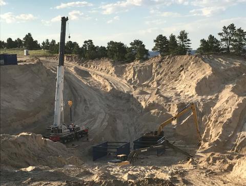 Excavation continues above the tunnel collapse. A series of three trench boxes, each 10 feet tall by 20 feet wide by 20 feet long will be dropped down into the space as soil is removed. (Photo courtesy the Goshen Irrigation District)