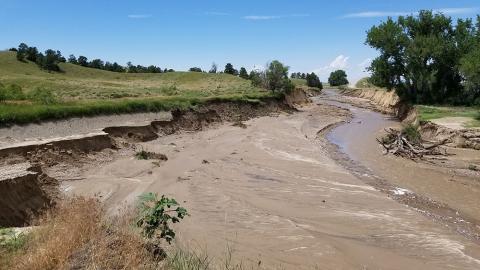 Irrigation canal washout from tunnel collapse