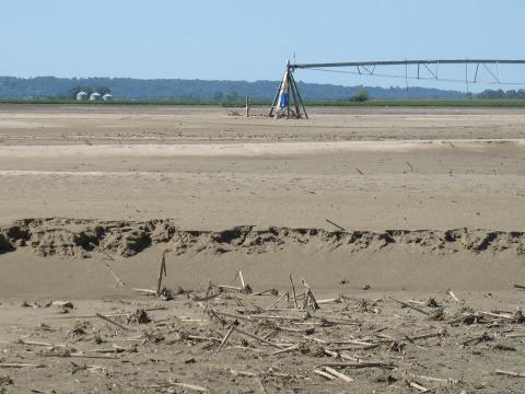 Sand-covered field with a center pivot