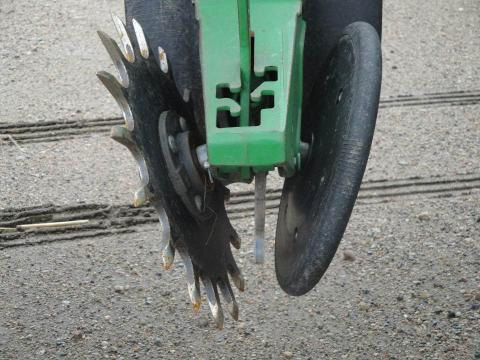 By replacing one solid closing wheel with a spiked one, closing the seed-vee becomes easier in a variety of conditions.