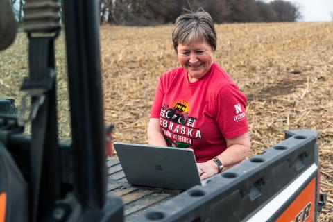 Farmer using online tool in field