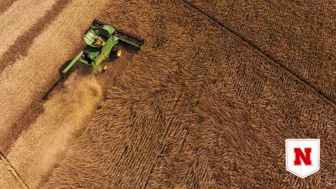 Aerial shot of combine in soybean field