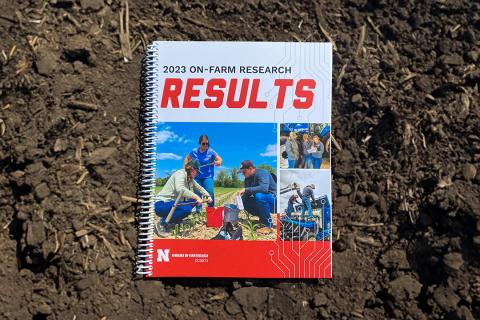 2023 Research Results book on top of soil