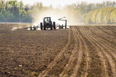 Tractor preparing ground for planting