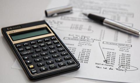 Calculator on top of tax paperwork