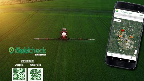 Tractor spraying pesticide with FieldCheck graphics