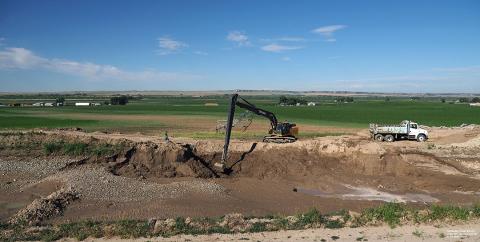 Digging crane in field